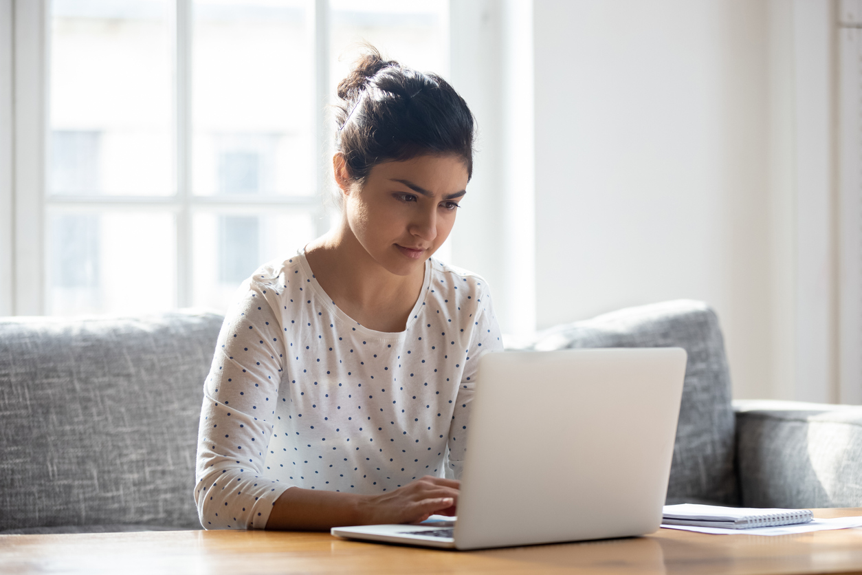 Photo of a woman using a laptop