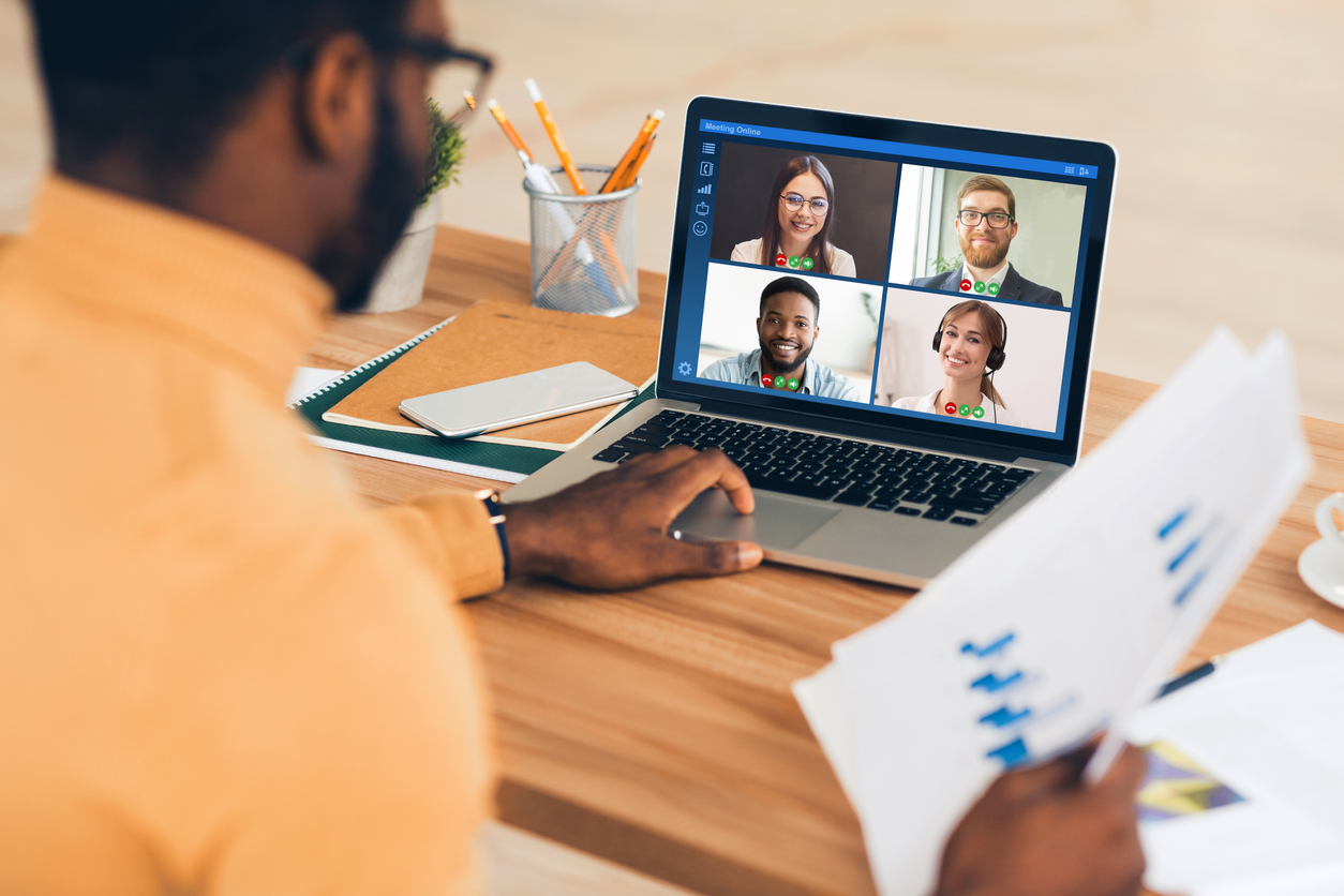 Man on virtual meeting taken place on a laptop